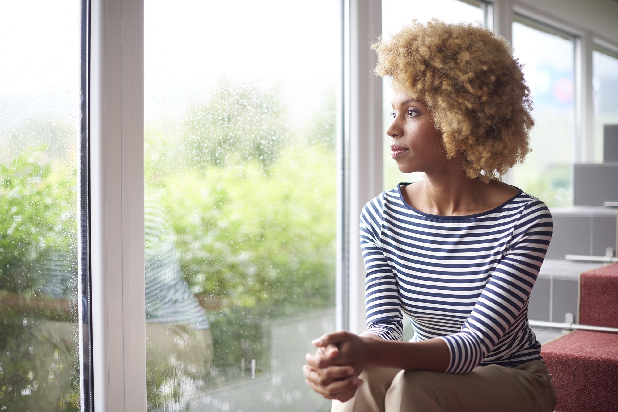 Masterjack Windows and Doors Woman looking out the window