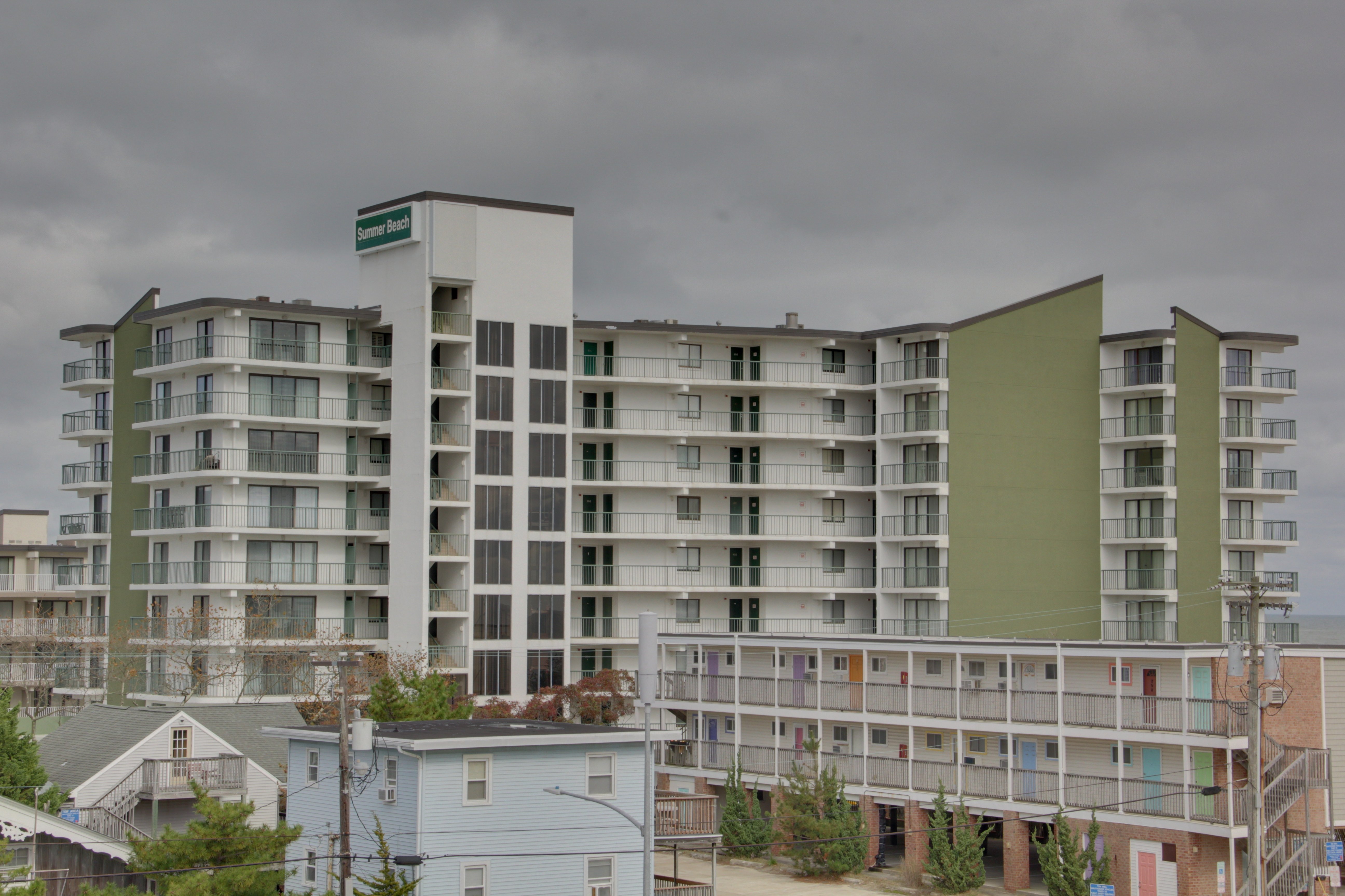 Summer Beach Condo Building white and green summer beach condominium building